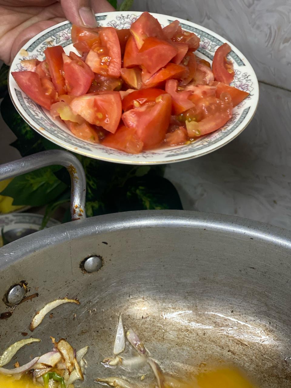 adding tomatoes